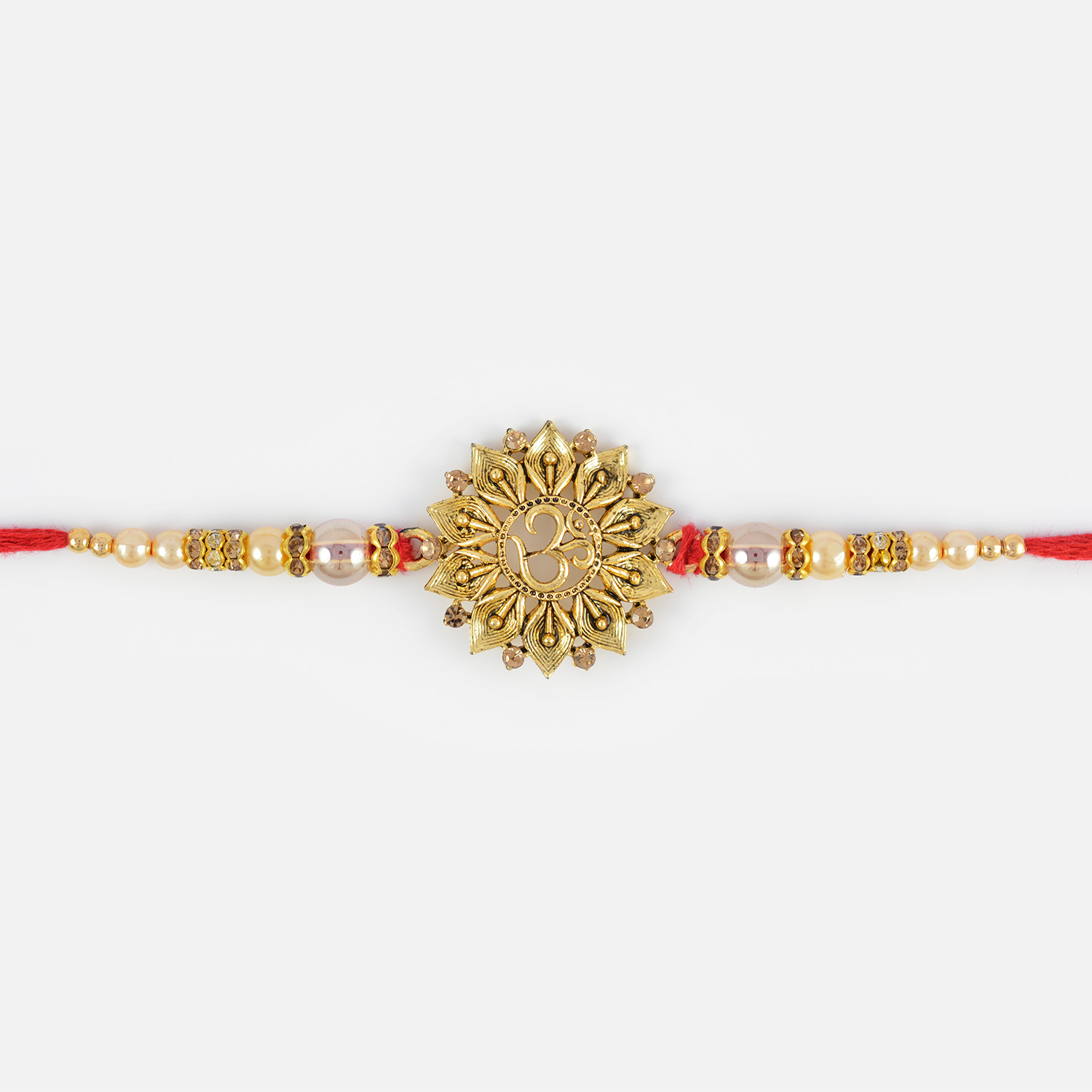 Floral Shape Golden Om Rakhi with Pearls and Diamonds