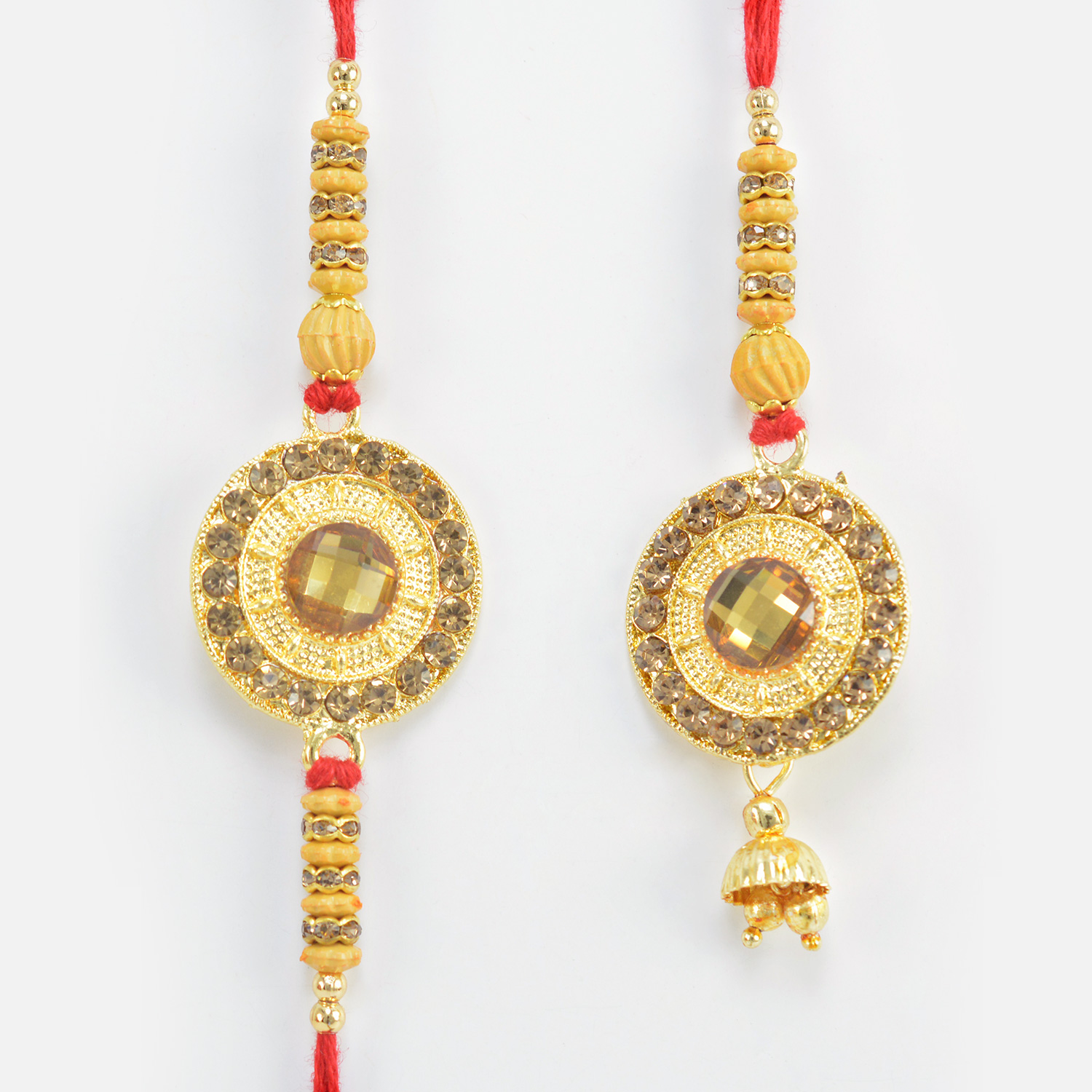 Kundan Crafted in Mid Coin Shape Rakhi for Brother with Lumba Rakhi for Bhabhi 