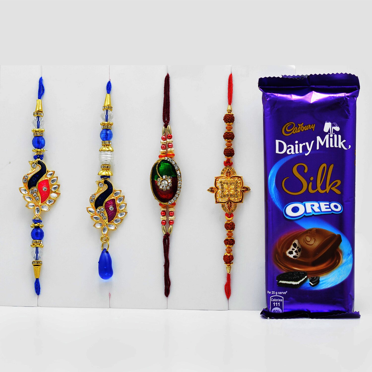 Maurya and Floral Designer Rakhi Set with Tasty Cadbury Dairy Milk Silk Oreo