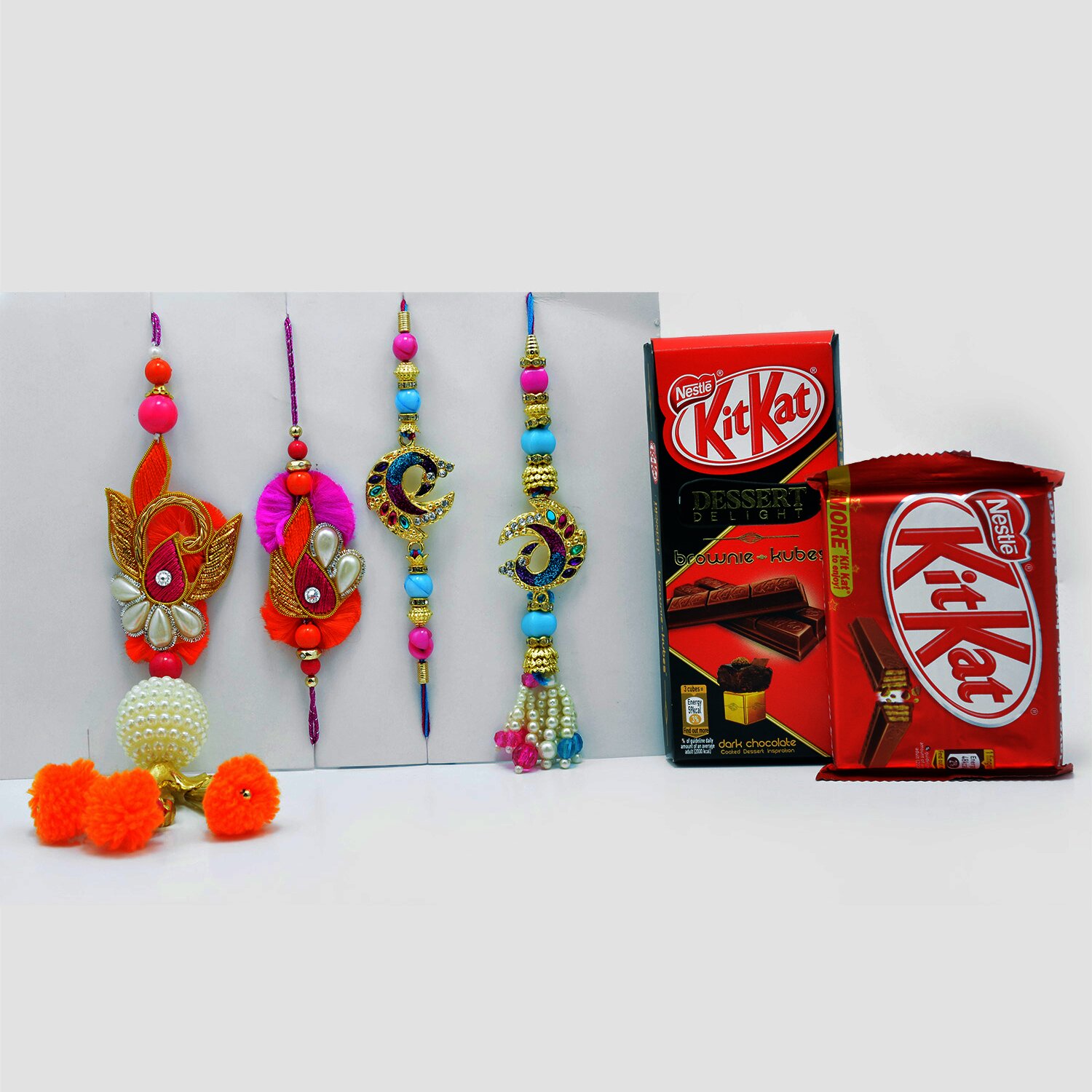 Magnificient Pair of 2 Bhaiya-Bhabhi Rakhi Set with Delicate Kit-Kat Chocolates