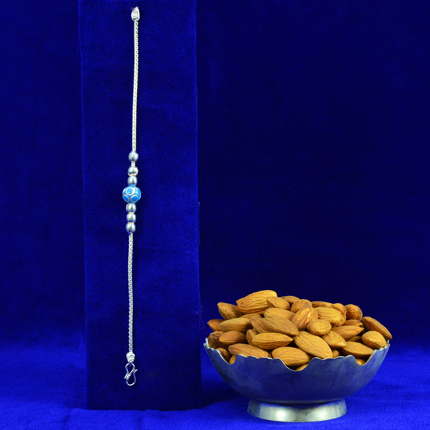 Simple Liner Blue Beads Pure Silver Rakhi with Almonds Dry Fruits