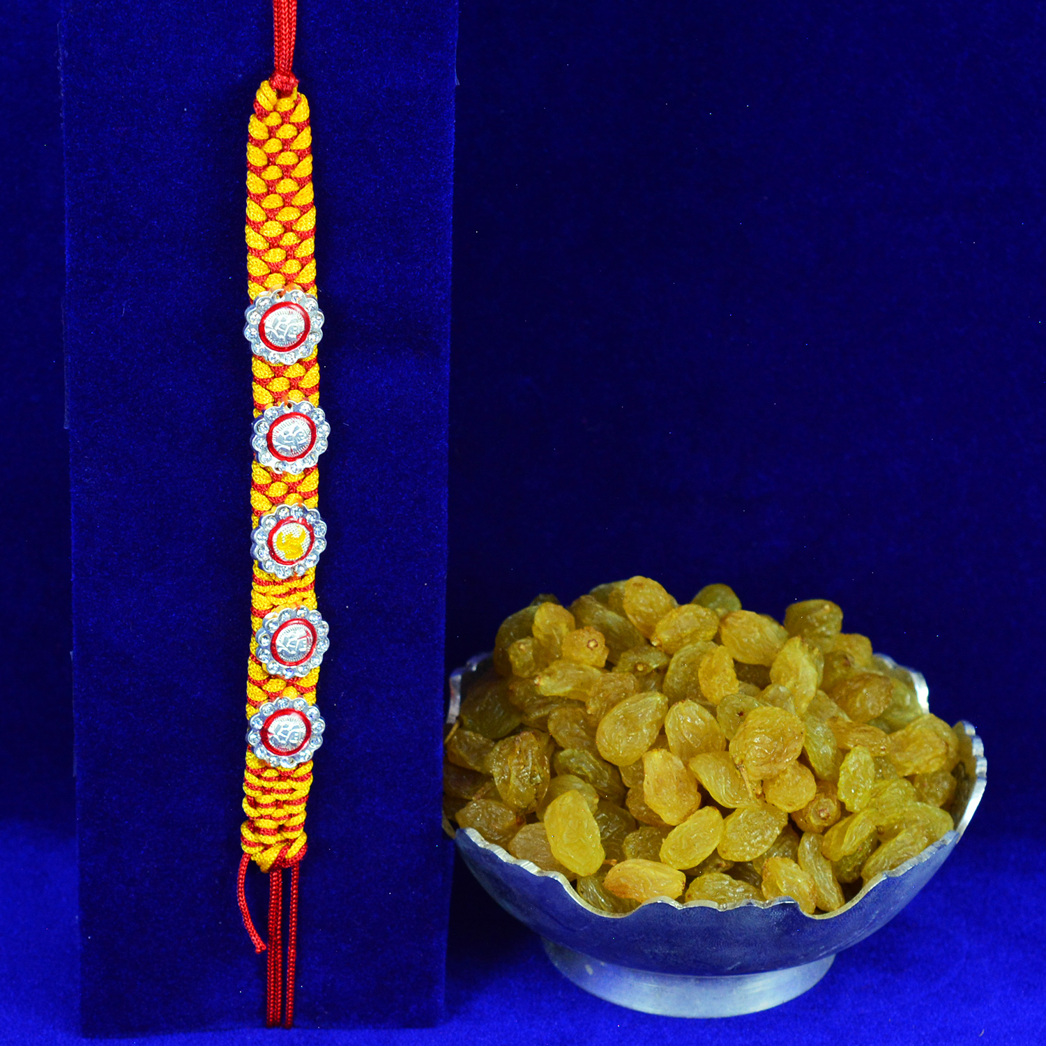 Floral Design Mauli Thread Pure Silver Brother Rakhi with Raisins Dry Fruits