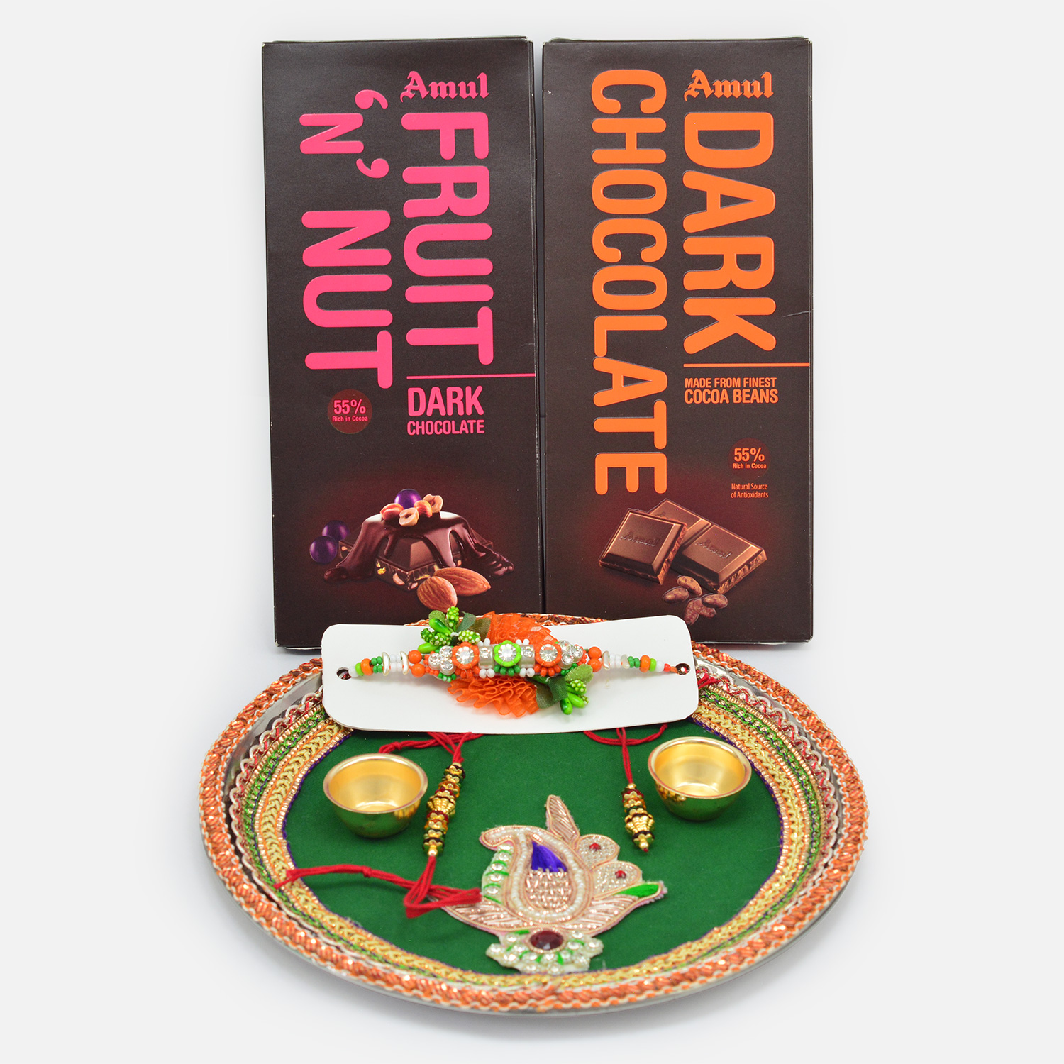 Amul Dark Chocolate and Fruit and Nut Chocolates with Rakhis along with Green Base Puja Thali