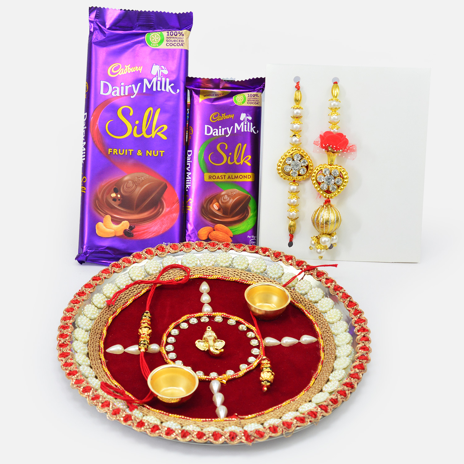 Dairy Milk Fruit and Nut and Roast Almonds Chocolate with Rakhis and Auspicious Pooja Thali