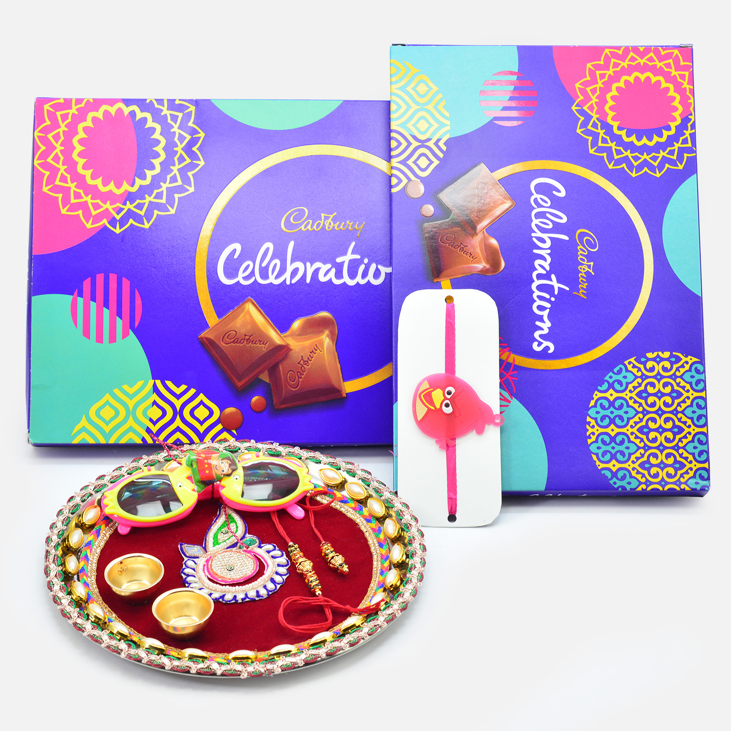 Cadbury Dairy Milk Chocolates Celebration Packs with Maroon Base Rakhi Pooja Thai and Family Rakhis Pack