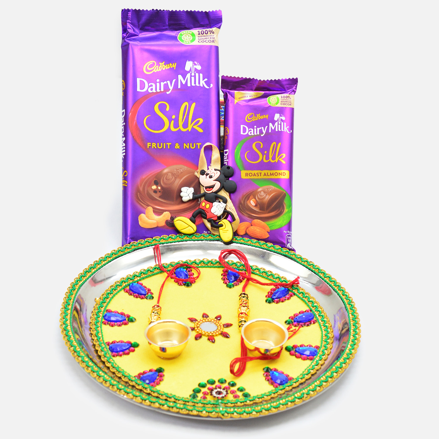 Yellow Color Base Design Blue Diamond Studded Puja Thali with Chocolates of Cadbury and Amazing Rakhis