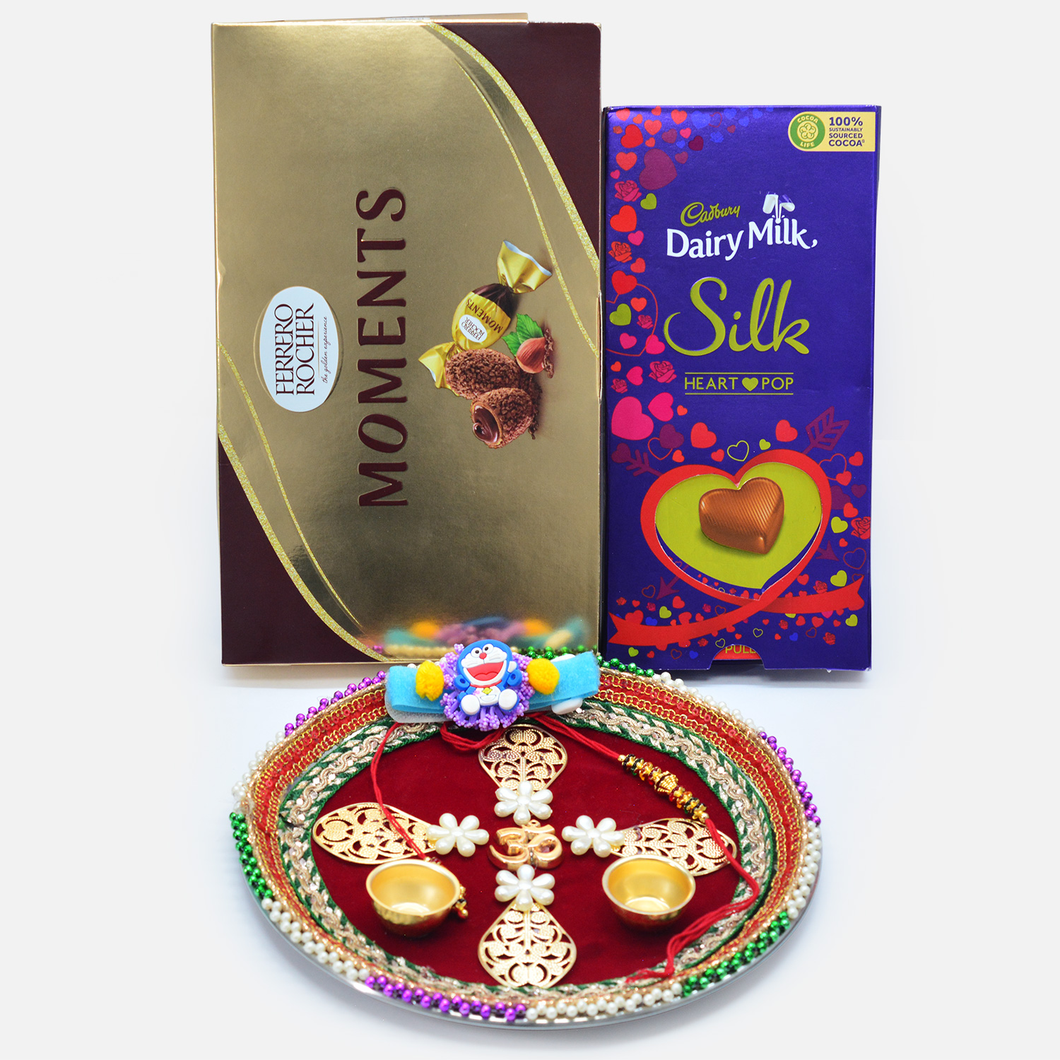 Ferrero Rocher Moments and Silk Heart Pop Chocolates with Family Rakhi Set and Designer Om Puja Thali