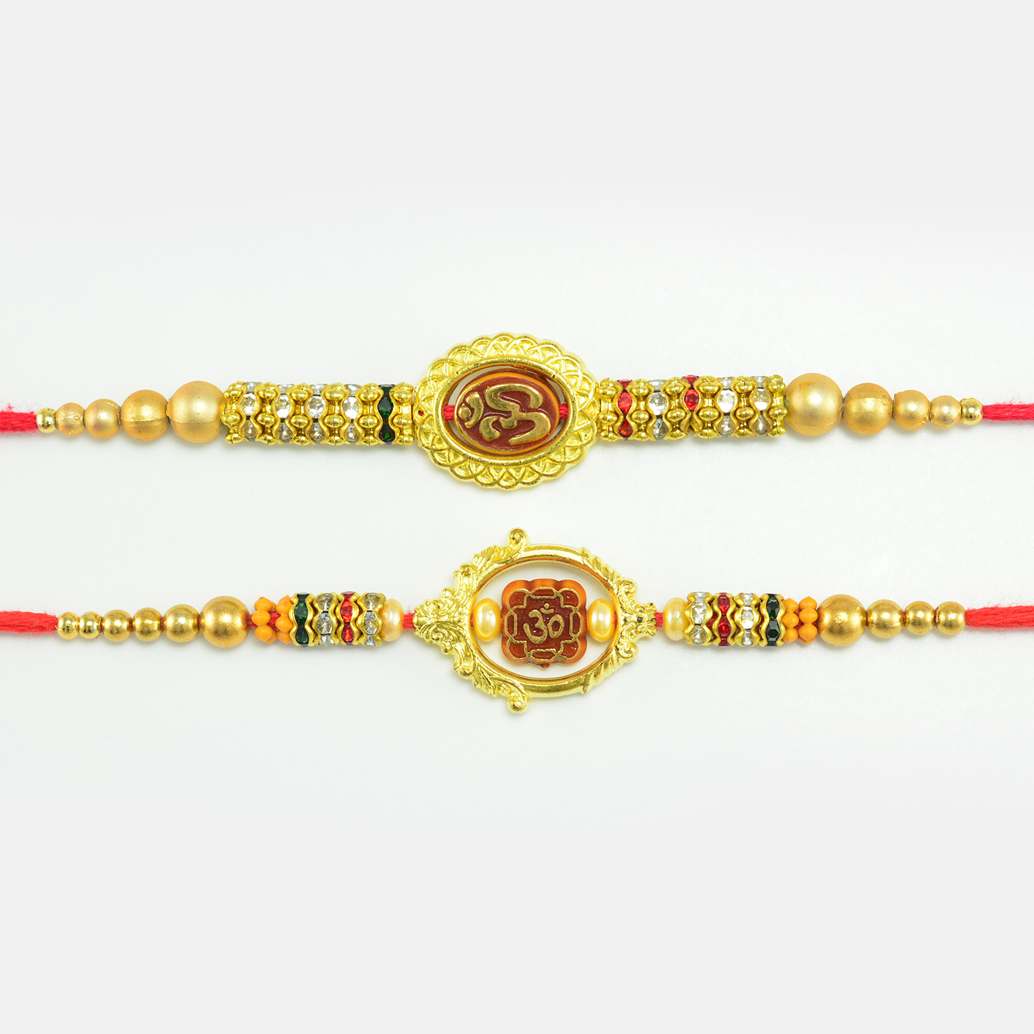 Golden Designer Om Rakhi Set of 2 with Studded Diamonds And Pearls