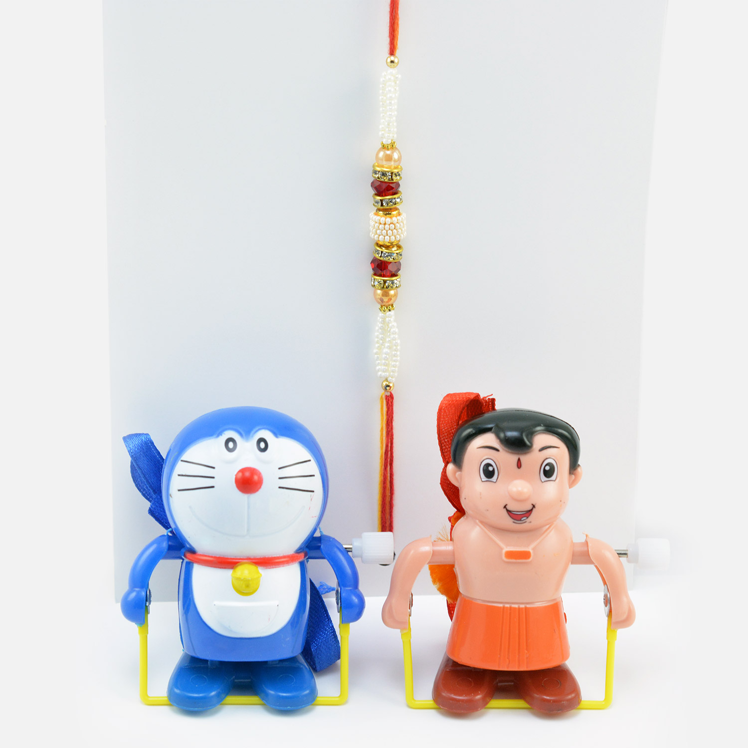 Doraemon and Bheem Rakhis Toy for Kid with One Beautiful Tread Rakhi.
