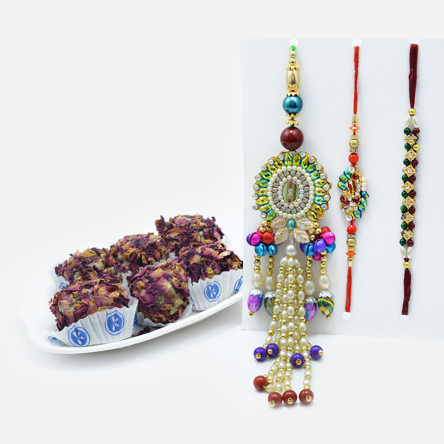 Multi-Coloured Beads and Pearls Rakhi Set of 3 with Heavenly Kaju Rose Laddu