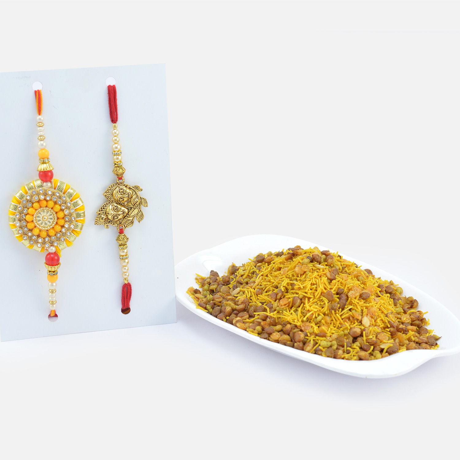 Mouth Watering Delicious Namkeen with Designer Zardosi and Divine Rakhis for Brother 