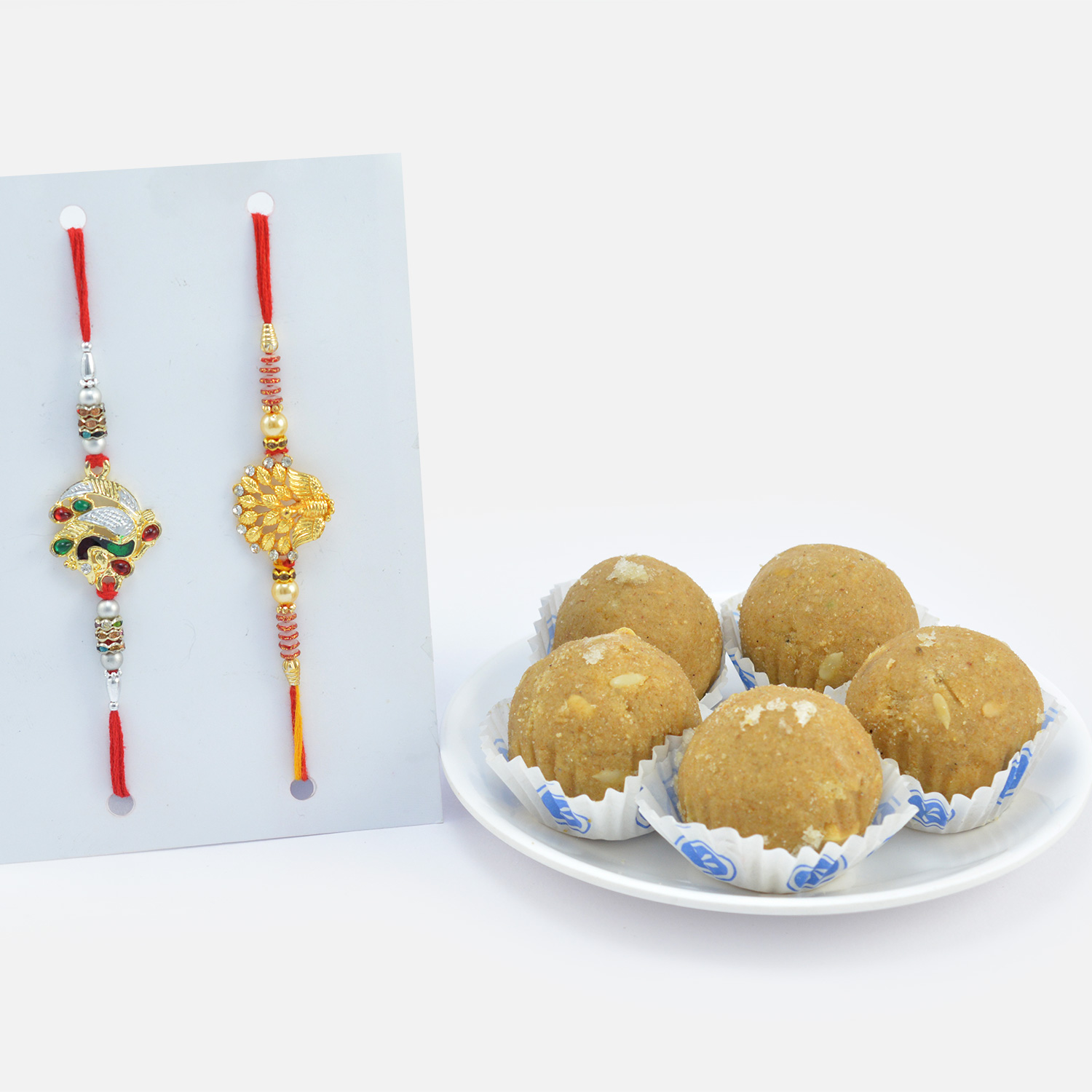 Two Beautiful Looking Peacock Rakhis for Two Brothers with Amazing Tasty Besan Ke Laddu