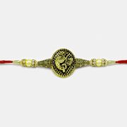 Graceful Golden Ganesha Rakhi with Pearls and Diamonds