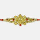 Awesome Looking Silver and Red Jewel Studded Pearl Golden Swastika Rakhi