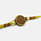 Lord Ganesha Emerged on Round Shape Pearl Beaded God Rakhi