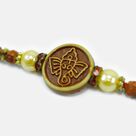 Lord Ganesha Emerged on Round Shape Pearl Beaded God Rakhi