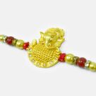 Awesome Looking Golden Color Emerged Divine Ganesha Rakhi for Brother
