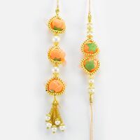 Surprising Pair of Stunning Looking Handmade Orange Color Flower Rakhi for Bhaiya and Bhabhi