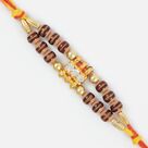 Brindled Wooden and Golden Beaded Double String Diamond Rakhi
