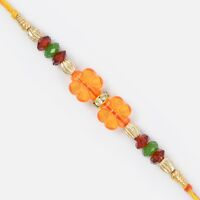 Transparent Floral Design Glass and Golden Beads Moli Rakhi