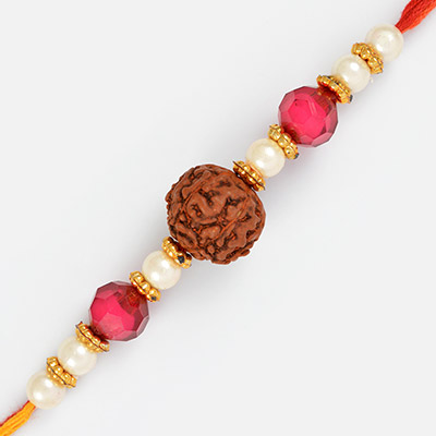 Central Auspicious Rakhi with Pearls Pink and Golden Beads