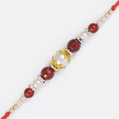 Pearl and Red Glass Beads in Golden Leafy Designs Fancy Rakhi