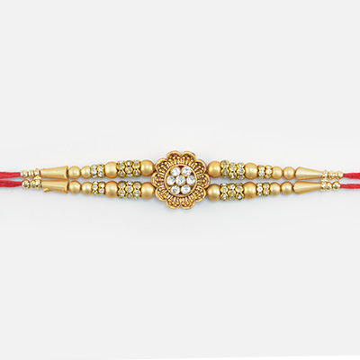 Flower Shape Design Jewel Studded in Mid Lovely Looking Golden Color Beads Rakhi