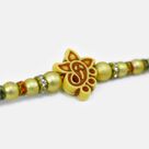 Small Ganesha in Mid Simple Fancy Design Attractive Looking Divine Beads Rakhi for Brother 