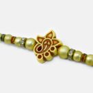Small Ganesha in Mid Simple Fancy Design Attractive Looking Divine Beads Rakhi for Brother 