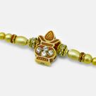 Auspicious Kalash in Mid with Golden Beads in Mauli Thread Nice Looking Beads Rakhi