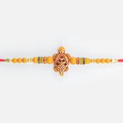 Good Luck Tortoise in Mid with Colorful Jewel and Simple Beads in Mauli Amazing Looking Rakhi for Brother