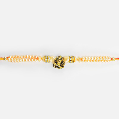 Awesome Looking Elegant Ganesha in Mid with Pearl Type Beads Rakhi for Brother