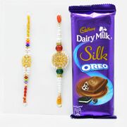 Delicate Golden Rakhi Set of 2 with Delicious Cadbury Dairy Milk Silk Oreo