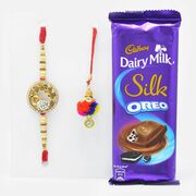 Golden Peacock Rakhi Set for Bhaiya-Bhabhi with Mouth-Watering Cadbury Dairy Milk Silk Oreo