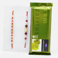 Elegant Rakhi Set of 2 with Cadbury Rum Raisin Temptation