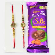Auspicious Two Swastika Rakhis with Dairy Milk Roast Almond Chocolate