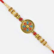 Magnificent Beauty of Golden Coin and Pearl Beaded Mauli Rakhi