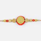 Attractive golden look of lord ganesha with pearl at base Rakhi