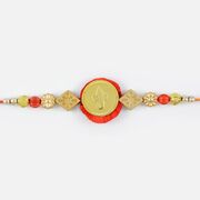 Attractive Golden Look of Lord Ganesha with Pearl at Base Rakhi