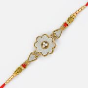 Floral Shape Silver Base Golden Linear Rakhi