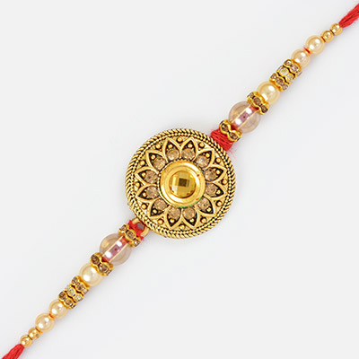 Antique Design Golden Rakhi with Transparnt Pearl