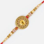 Antique Design Golden Rakhi with Transparent Pearl