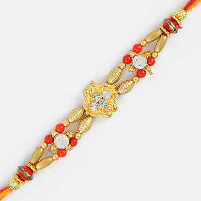 Impressive Golden Work Fancy Rakhi with Diamonds and Red Beads