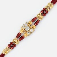 Golden Grace with Diamonds and Maroon Beads Fancy Rakhi