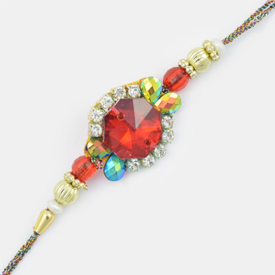 A Fine Creation with Red Stone- Golden Beads and Diamond Rakhi