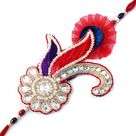 Heritage art of Kundan, Zardosi, Pearl and studded with diamonds in design of peacock fancy Rakhi
