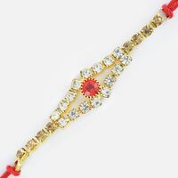 Magnificent Golden Base Rakhi with Studded Small Red Diamond Rakhi