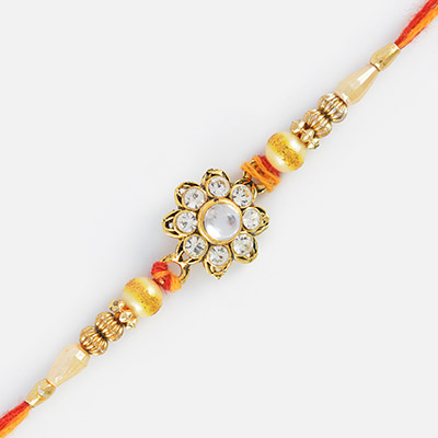 Floral Studded Diamonds Rakhi with Pearl and Golden Beads