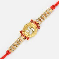 Golden Circular Base Silver Swastik Jewel Rakhi