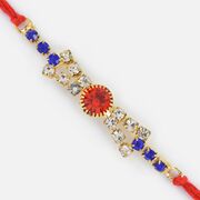 Silver Designer Fancy Rakhi with Red and Blue Jewels